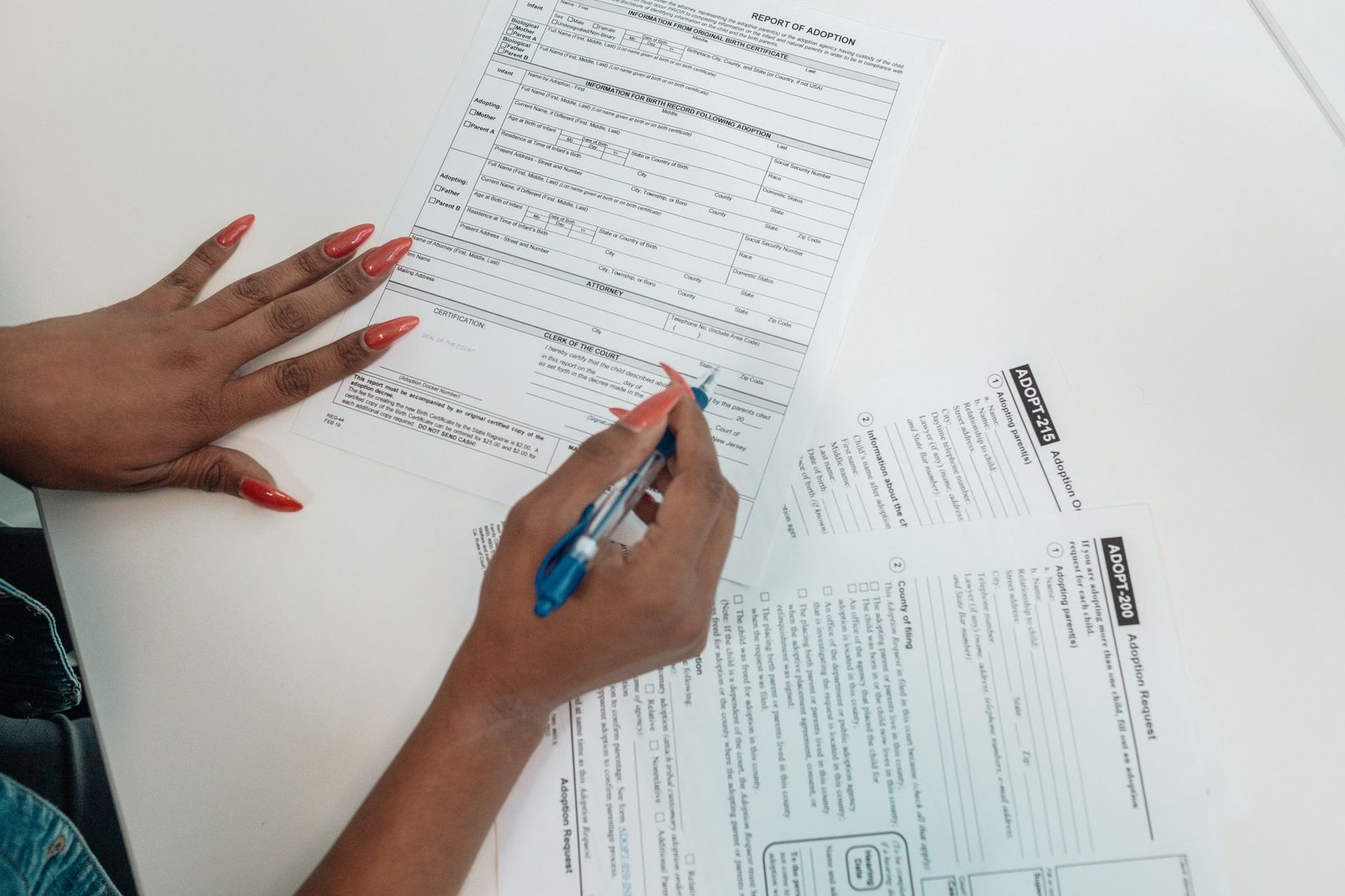 Hands organizing medical and service records relevant to the VA duty to assist evidence-gathering process