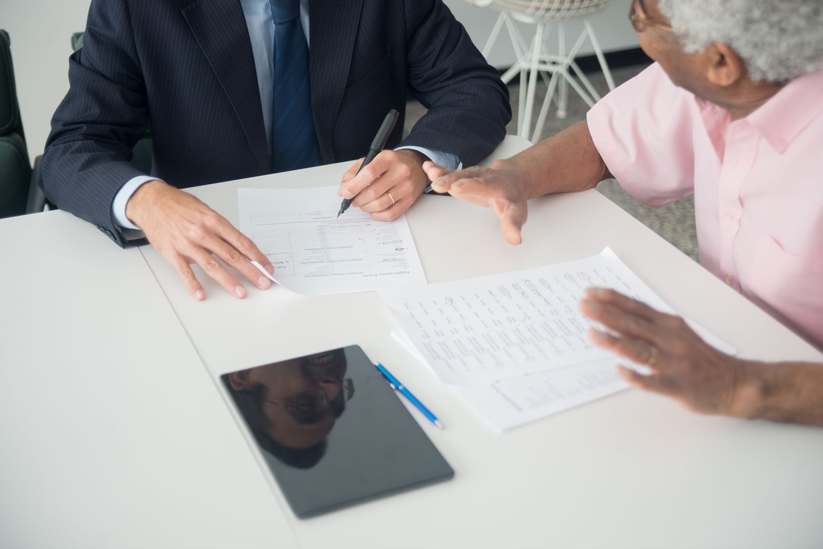 Veteran reviewing VALife insurance for disabled veterans paperwork with an advisor