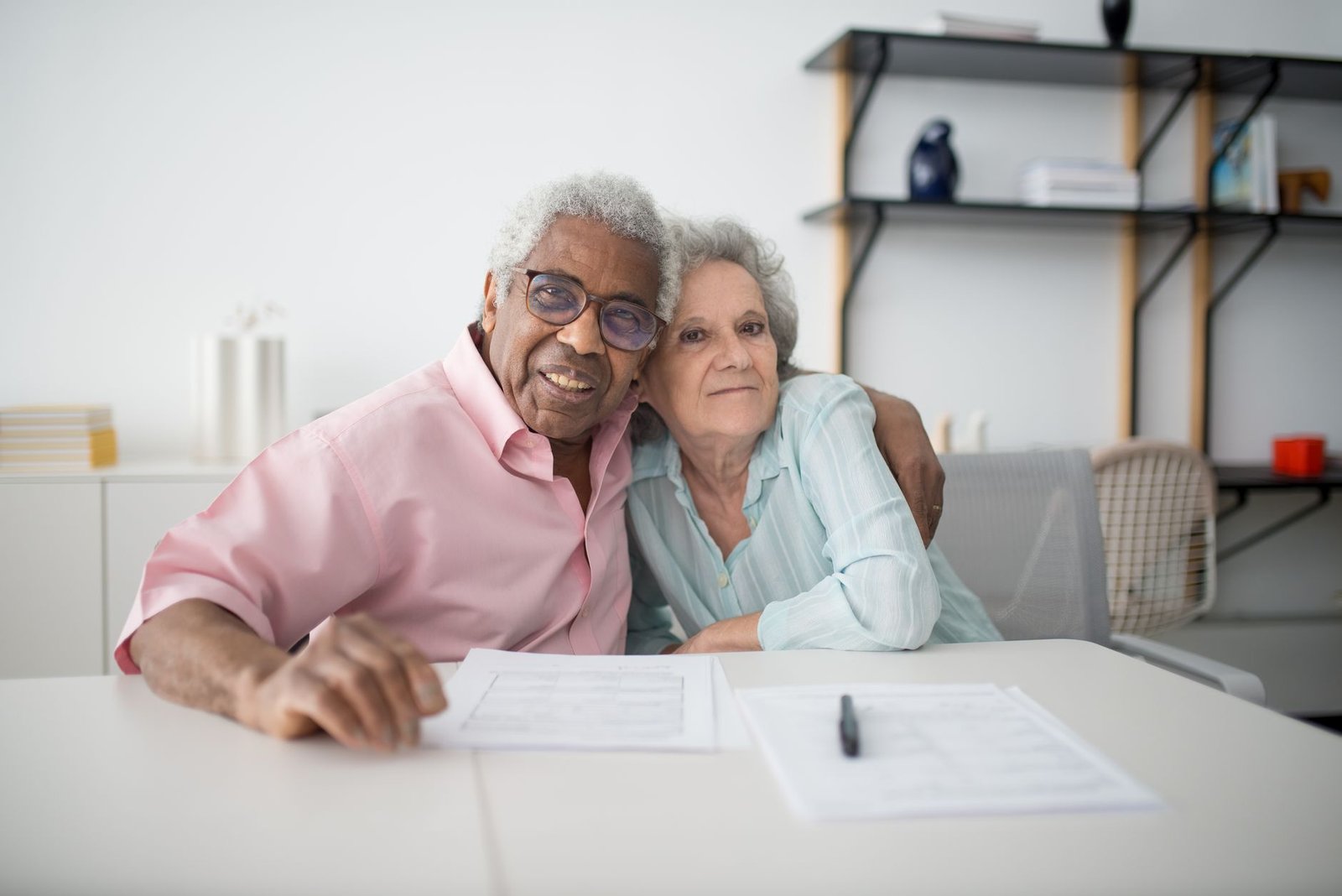 Veteran couple discussing VA disability protected ratings rules together at home