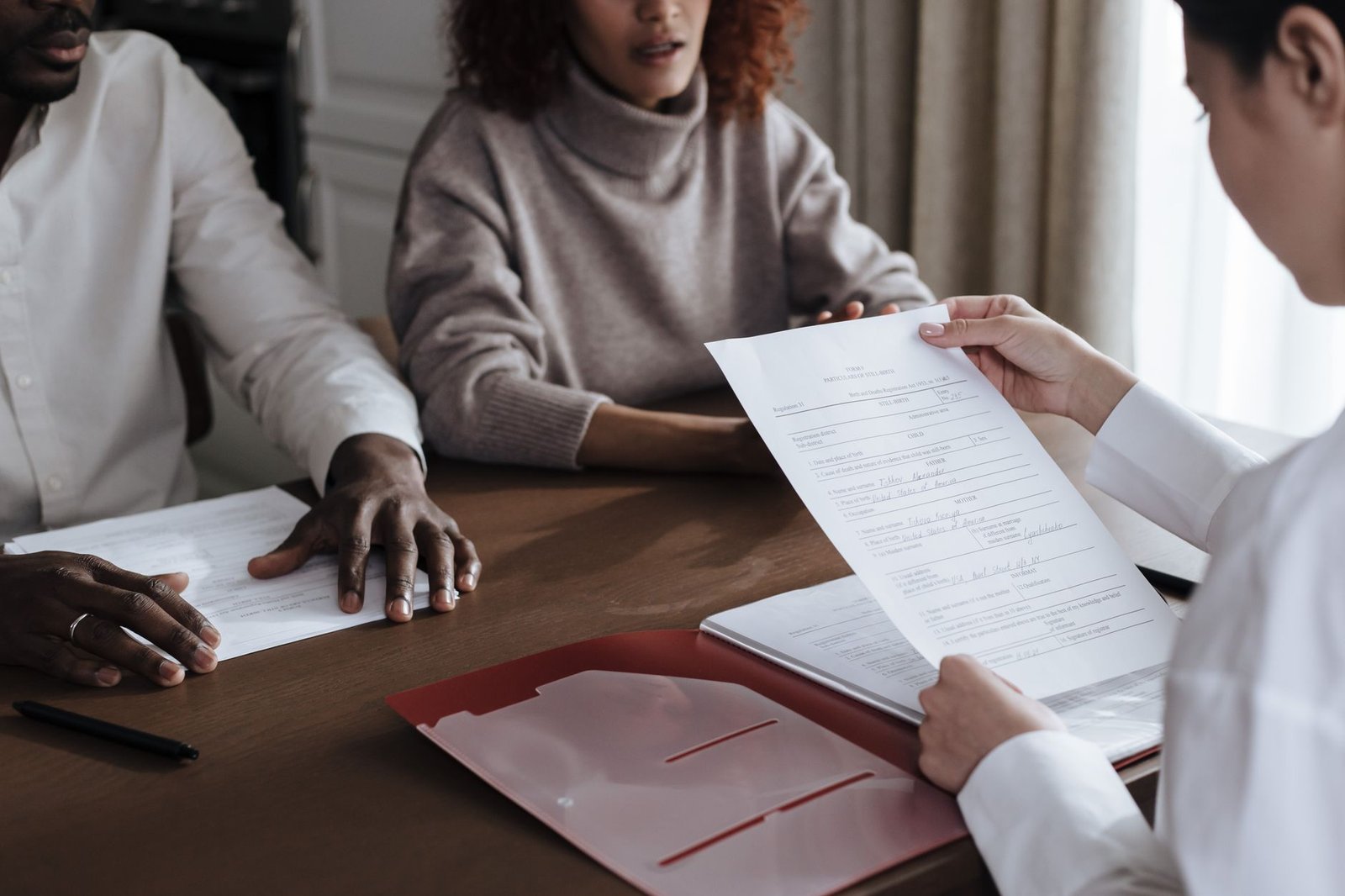 Veteran and spouse discussing next steps after a VA claim deferred decision with an advisor
